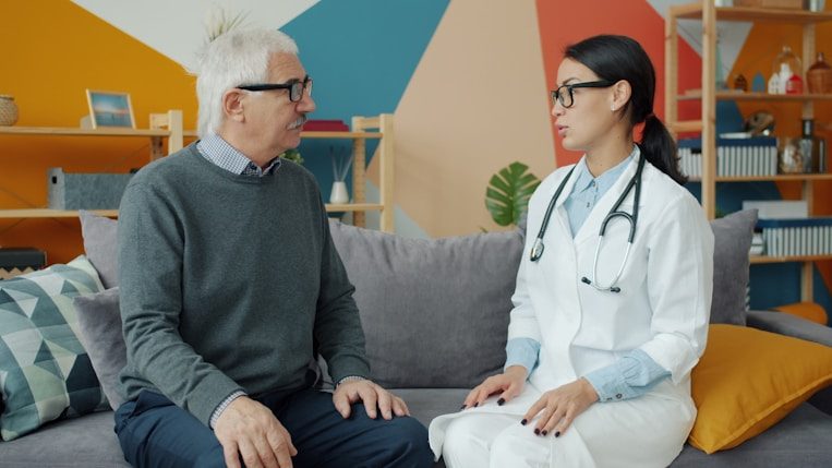 Clinician talking with an older patient