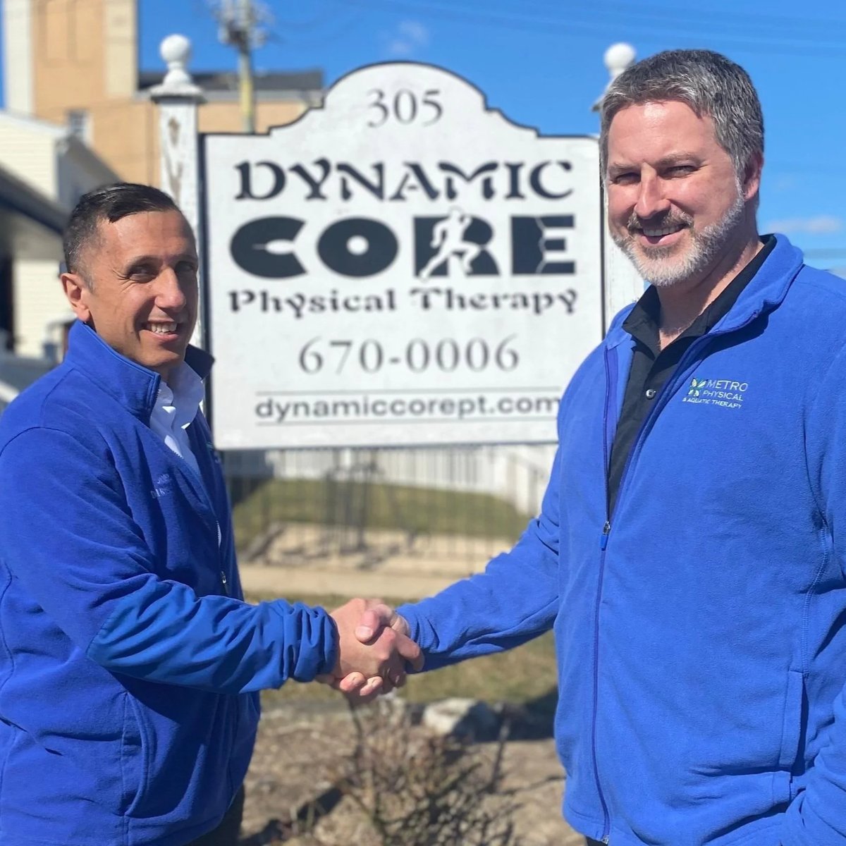 Practice owner and Metro team member shaking hands outside Dynamic Core Physical Therapy